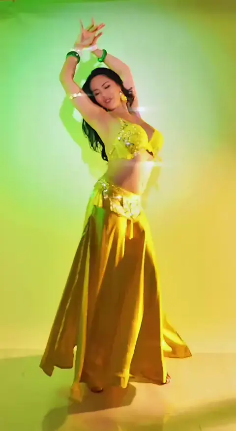 Traditional belly dance pose by Elma demonstrating authentic technique in Bali